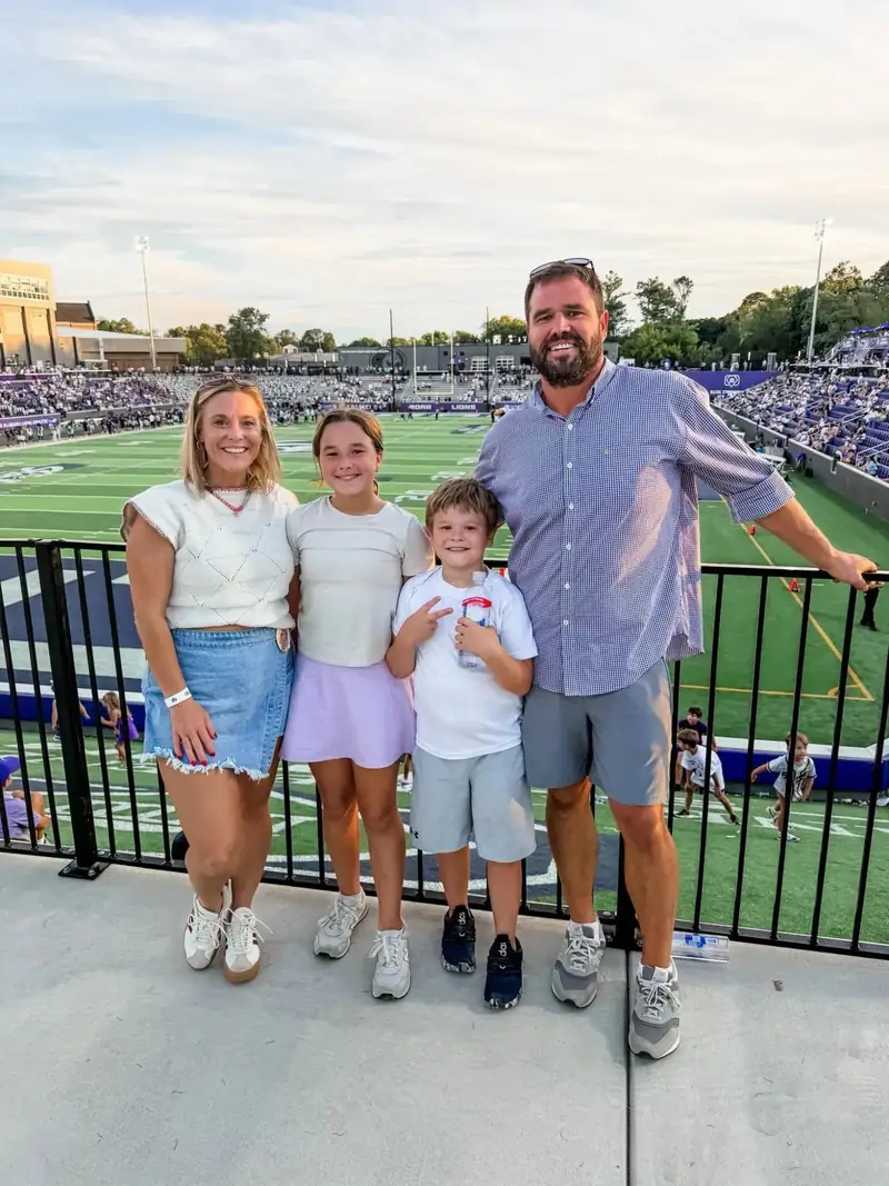 Clint and Shelley Carter with their kids at a football game, the family behind Streamline Construction Services