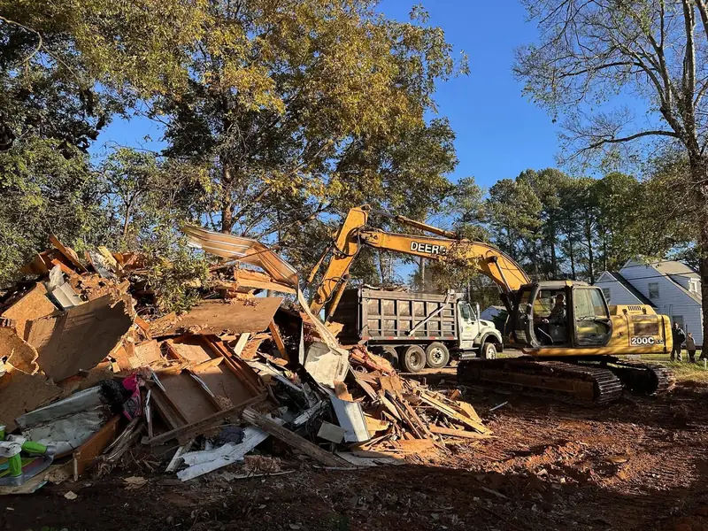 Demolition debris being loaded into a dump truck