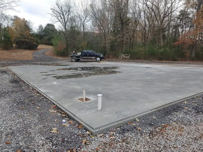 Slab pad prepared with plumbing stubs before the pour