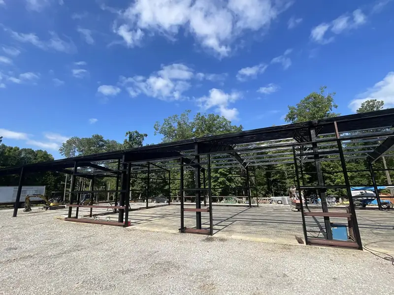 Steel building frame going up on a pad Streamline prepared