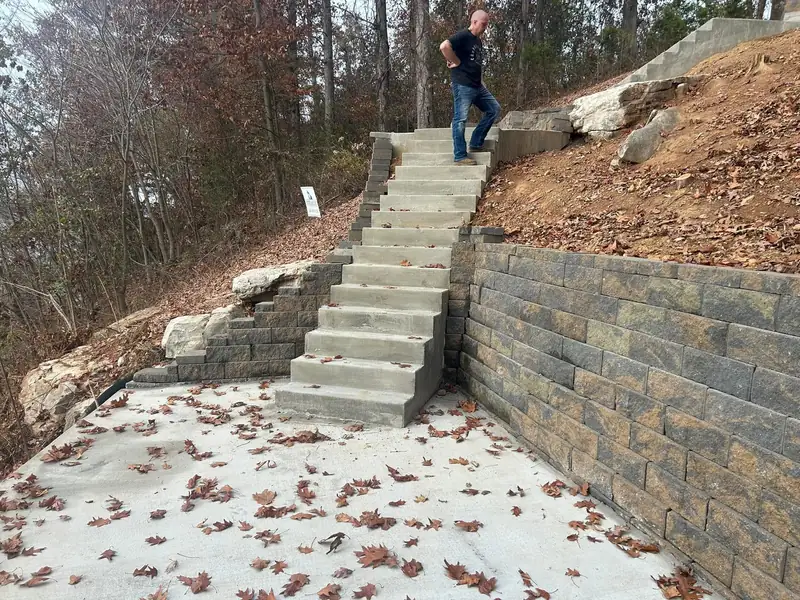 Concrete steps and block retaining wall leading to a patio