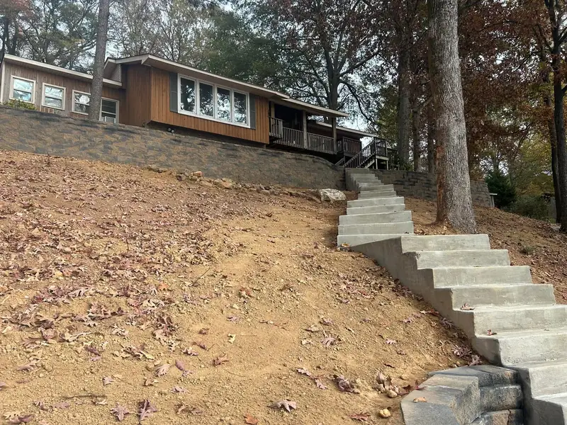 New block retaining wall and steps on the same lake house slope