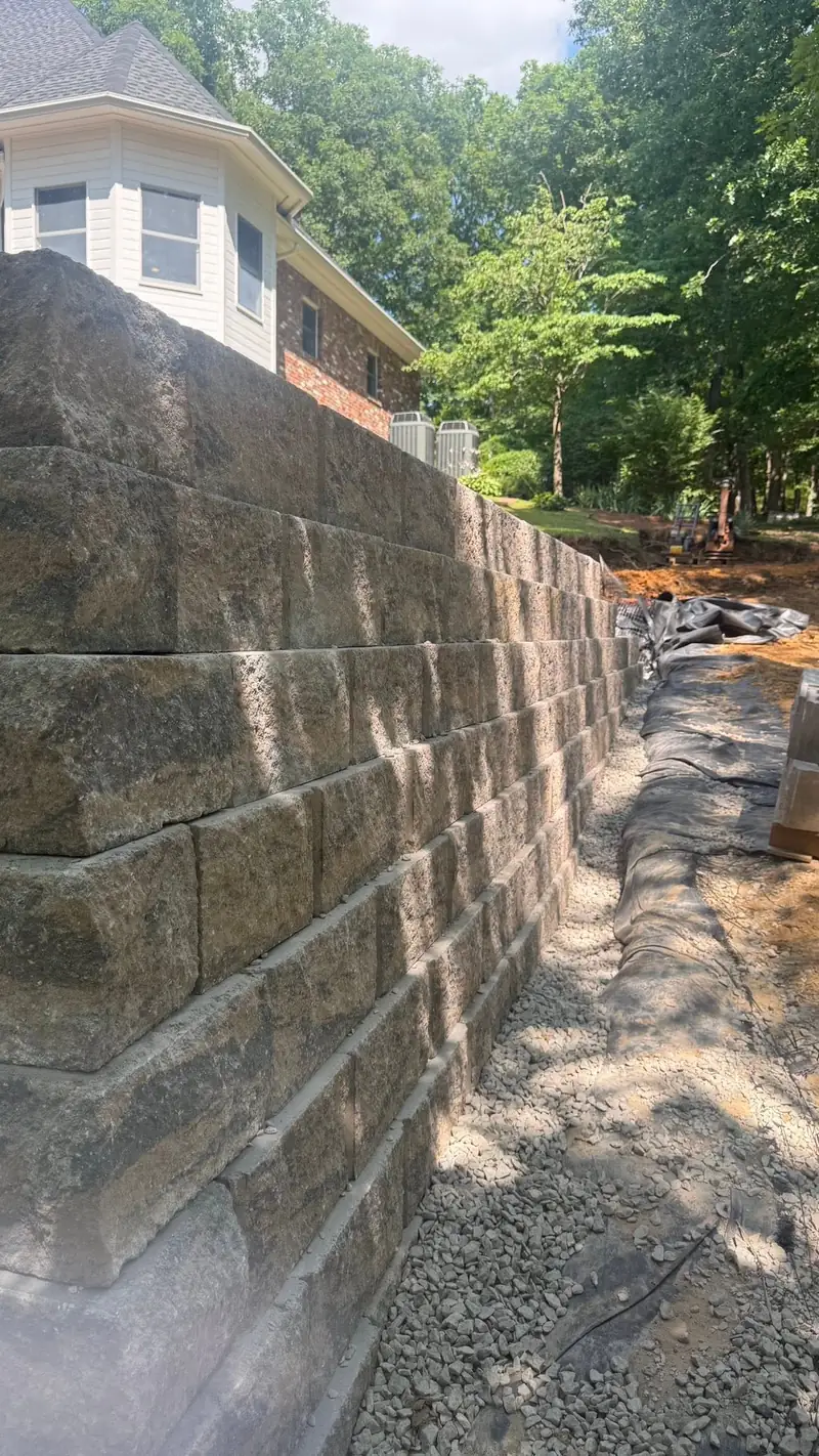 Tall segmental block retaining wall